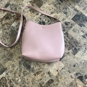 Anthropologie Samara Vegan Leather Crossbody Bag in a shade of pink